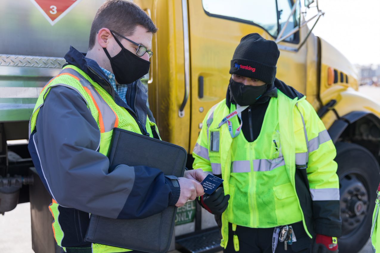 David Staples, PHL Director of Safety Management System, explains hazard reporting process to an employee.