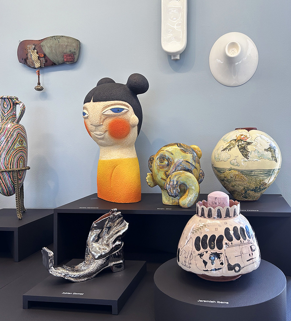 various ceramic sculptures against a pale blue background