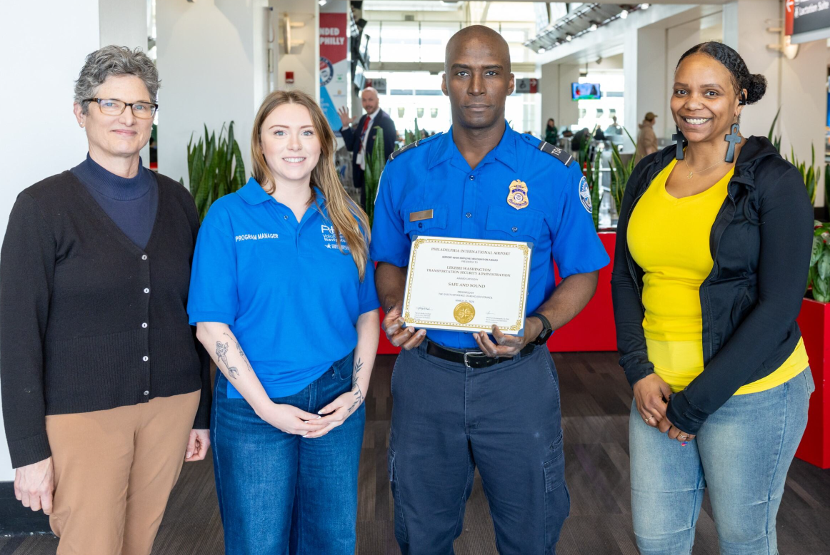 Lekebie Washington receiving award