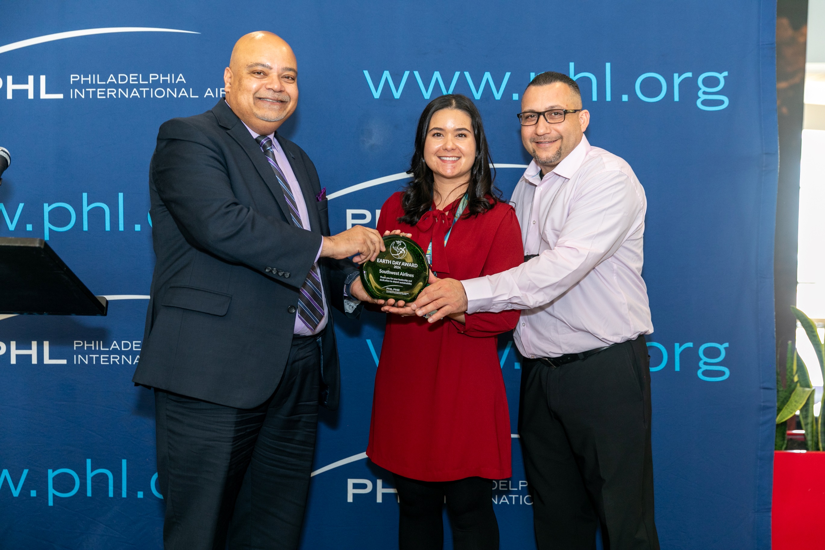 From left, Atif Saeed with Southwest's Jessica Rouvaldt and Manny Centeno