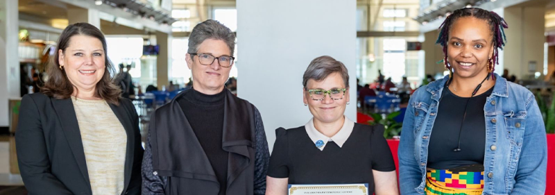 Heather holding award
