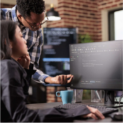 person getting help from IT at computer