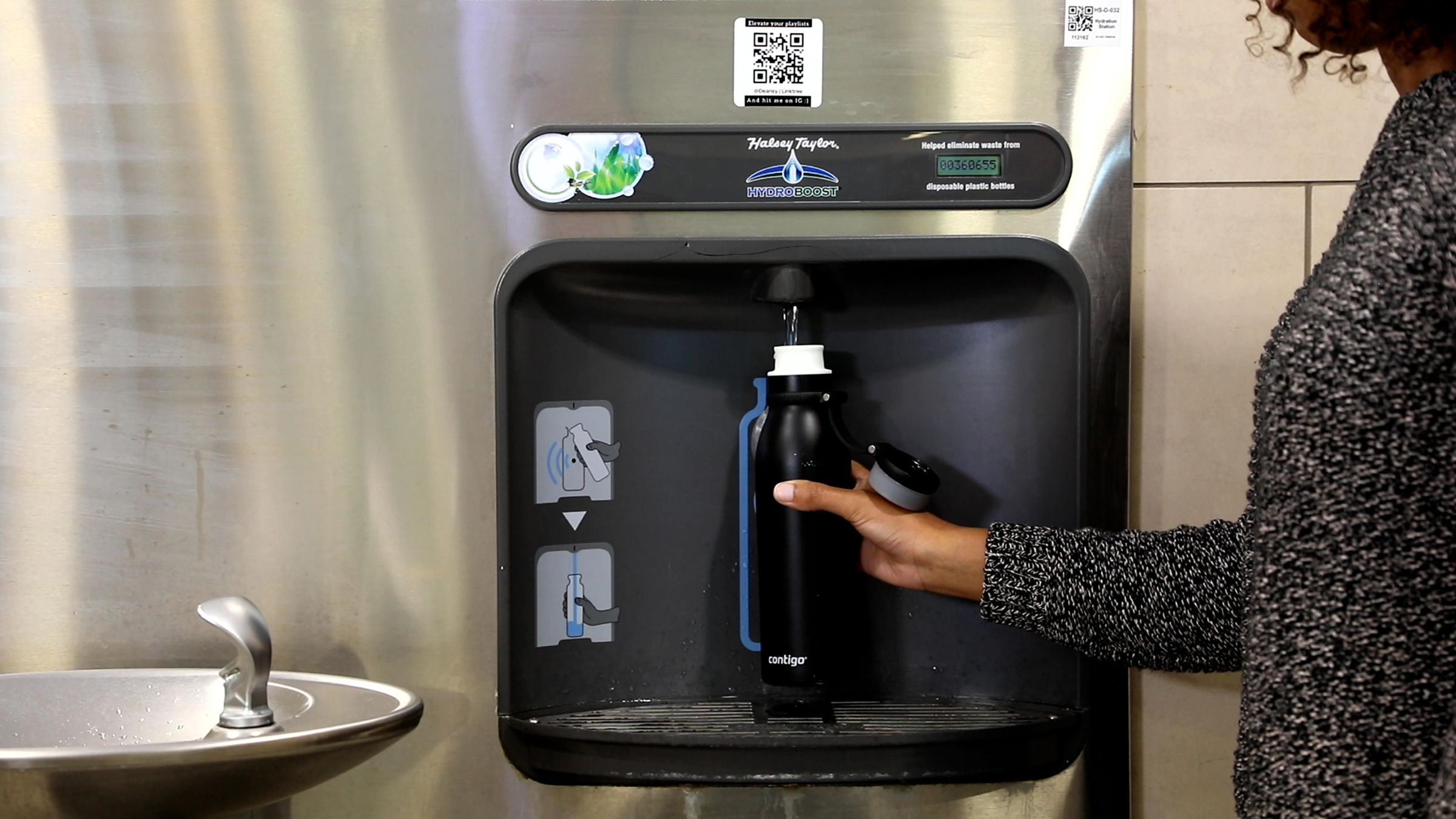 a woman refilling a water bottle