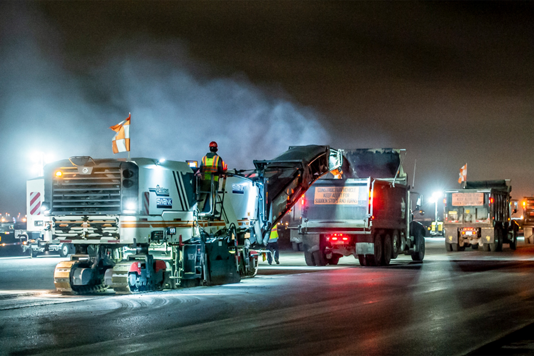 Surface paving of Runway 9R–27.